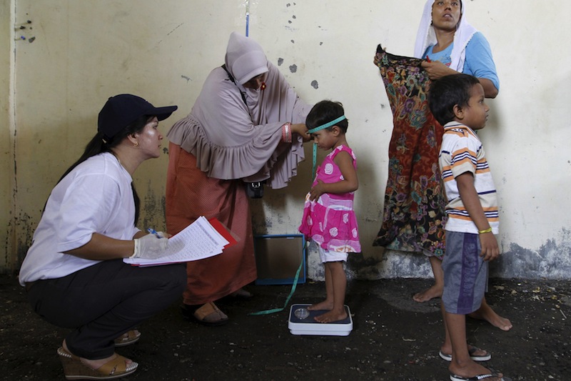 A Rohingya child, who recently arrived in Indonesia by boat, is measured and weighed at a shelter in Kuala Langsa, in Indonesia's Aceh Province, May 17, 2015.u00c2u00a0u00e2u20acu201d Reuters pic