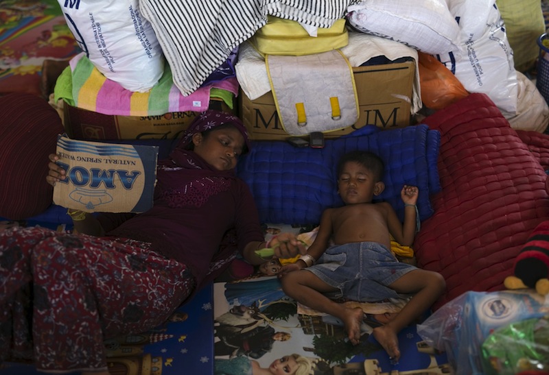 Rohingya migrants, who arrived in Indonesia recently by boat, rest at a temporary shelter in Kuala Langsa, in Indonesia's Aceh Province May 24, 2015. u00e2u20acu201d Reutrers pic