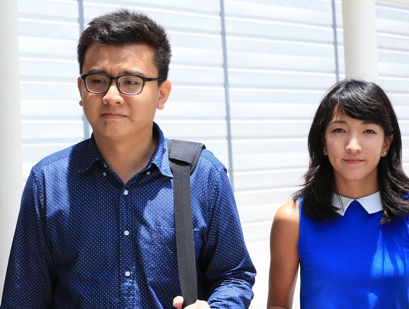 The duo behind The Real Singapore, Ai Takagi (right) and Yang Kaiheng (left) arriving at court on April 14, 2015. u00e2u20acu2022 Today pic
