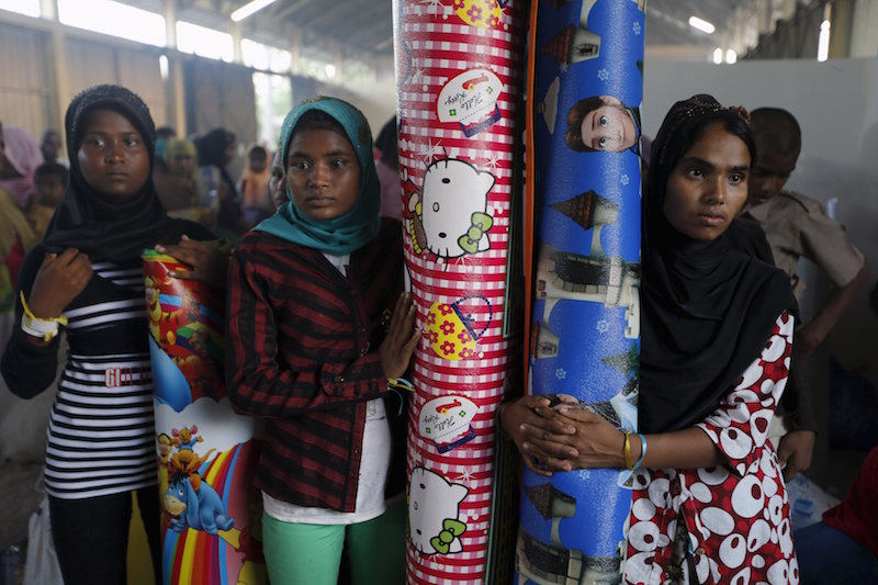 Rohingya migrant women, who recently arrived in Indonesia by boat, hold their new mattresses, for sleeping, inside a shelter in Kuala Langsa, in Indonesiau00e2u20acu2122s Aceh Province, May 19, 2015. u00e2u20acu201d Reuters pic
