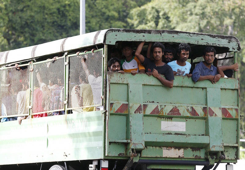 Rohinyga and Bangladeshi refugees are transported to a navy boat where they will be taken to mainland Malaysia, after they landed at Pantai Pasir Berdengung beach in Langkawi May 14, 2015. u00e2u20acu201d Reuters pic