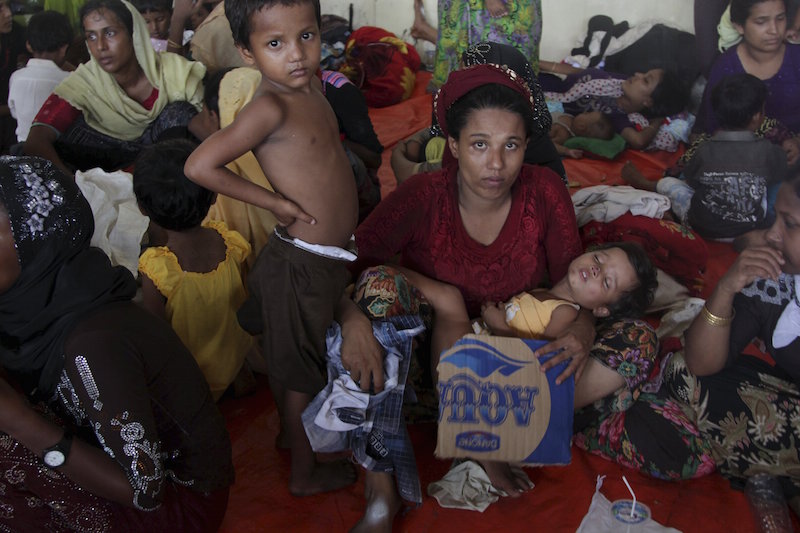 A group of Rohingya and Bangladeshi migrants, who arrived in Indonesia by boat today, gather in temporary shelter in Langsa, Aceh Province May 15, 2015, in this photo taken by Antara Foto. u00e2u20acu201d Reuters pic