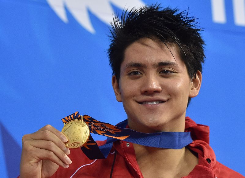 Singaporeu00e2u20acu2122s Joseph Schooling winning gold for the menu00e2u20acu2122s 100m butterfly swimming event, 17th Asian Games, Munhak Park Tae-hwan Aquatics Centre, Incheon, September 24, 2014. AFP PHOTO / PHILIPPE LOPEZ