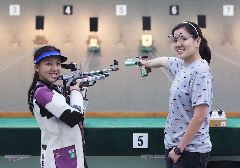 National shooters Jasmine Ser (left) and Teo Shun Xie hope to make every shot count during the Games’ shooting competition. — TODAY pic