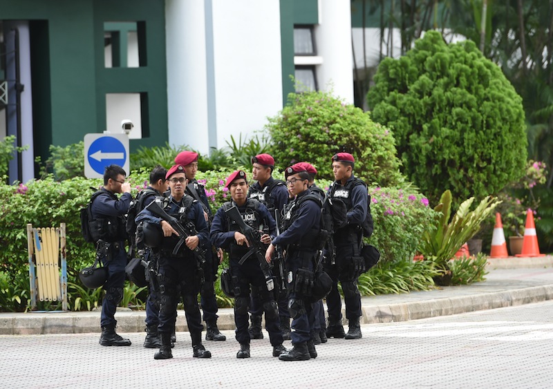 Armed policemen from Singapore's Special Operation Command gather at a school compound near to the Shangri-La hotel in Singapore on May 31, 2015. u00e2u20acu201d AFP pic