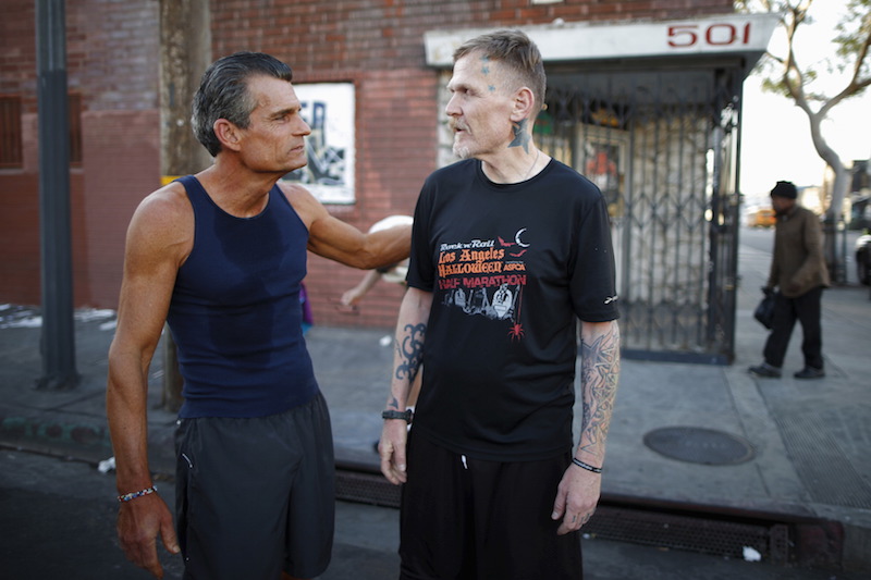 Los Angeles Superior Court Judge Craig Mitchell (left) congratulates Ben Shirley after a Midnight Mission Running Club sunrise run through Skid Row in Los Angeles April 16, 2015. u00e2u20acu201d Reuters pic
