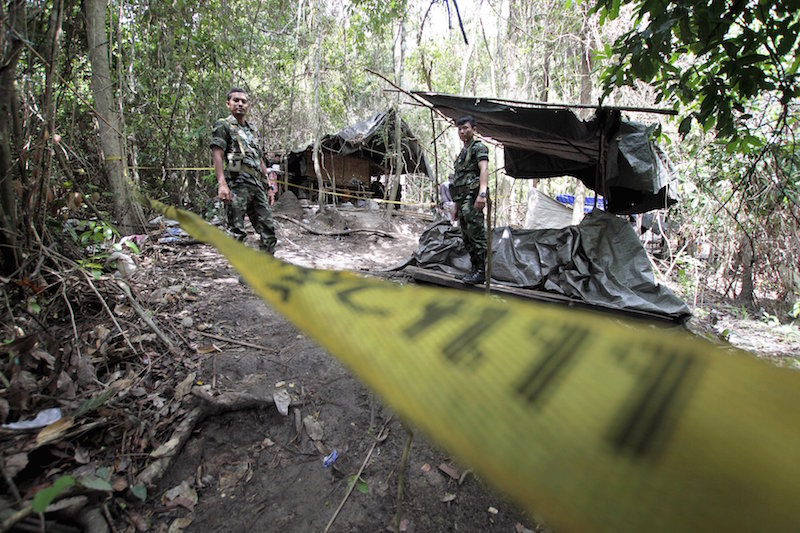 Security forces are seen at an abandoned camp in a jungle some 300m from the border with Malaysia, in Thailandu00e2u20acu2122s southern Songkhla province May 2, 2015. u00e2u20acu201d Reuters pic