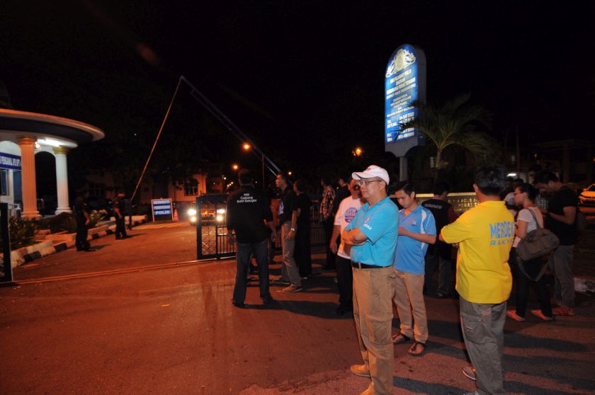 Keadilan members wait outside the central Seberang Perai police station where Tian Chua was brought in, May 3, 2015. u00e2u20acu201d Picture by K.E. Ooi