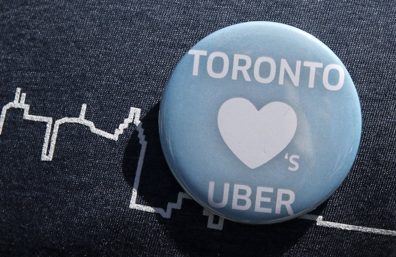 An Uber supporteru00e2u20acu2122s pin is seen during a rally in front of city hall in Toronto May 6, 2015. u00e2u20acu201d Reuters pic
