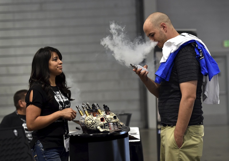 Jerred Marsh samples flavoured vape juice from Nancy Reyes at the Vape Summit 3 in Las Vegas, Nevada May 2, 2015. u00e2u20acu201du00c2u00a0Reuters pic