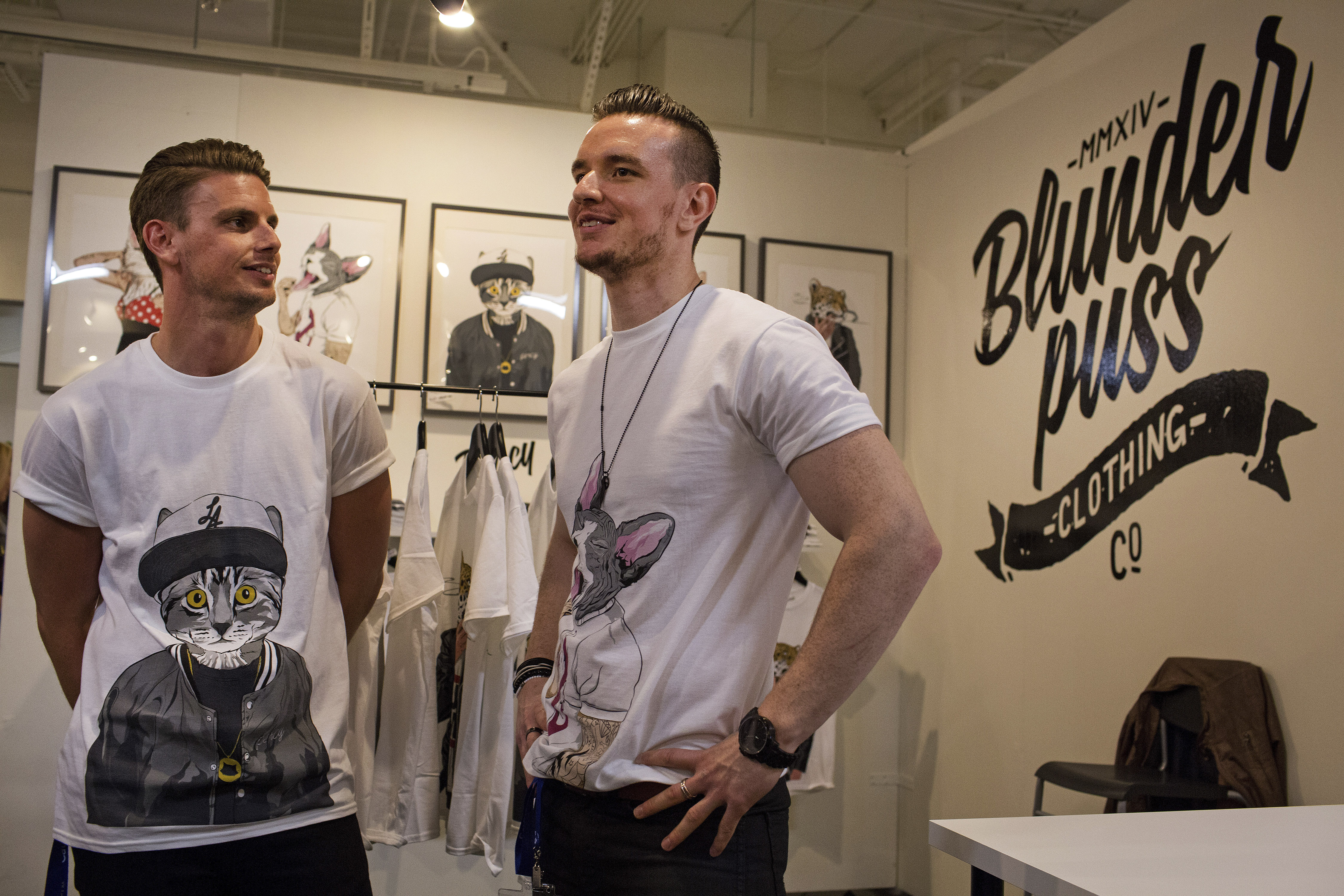 Brothers Greg and Andrew Wade at the booth for their clothing company, Blunderpuss, during CatCon in Los Angeles, June 8, 2015. — Monica Almeida/The New York Times