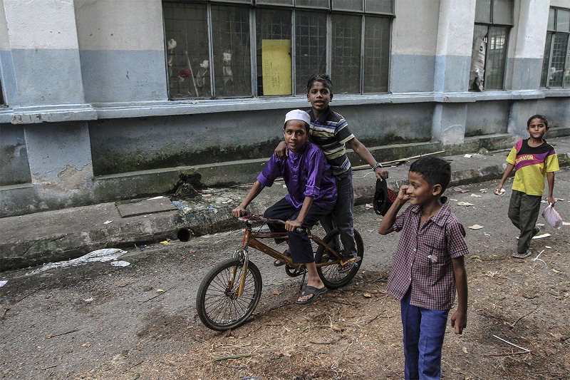 Rofi Nasir Ahmed, 10, rides his bicycle as he plays with his other friends at the Madrasah Muiin Al-Islam in Meru, Klang, on May 28, 2015. — Picture by Yusof Mat Isa