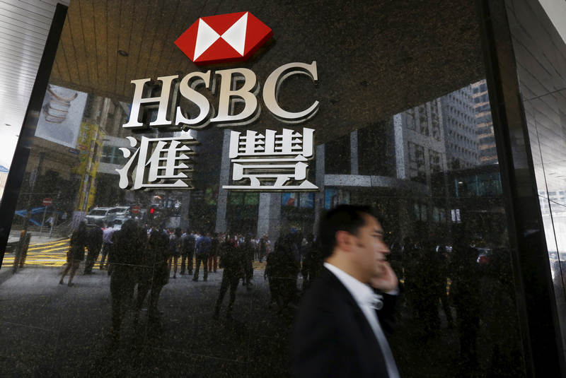 A man walks past a branch of HSBC at the financial Central district in Hong Kong, June 2, 2015. — Reuters pic