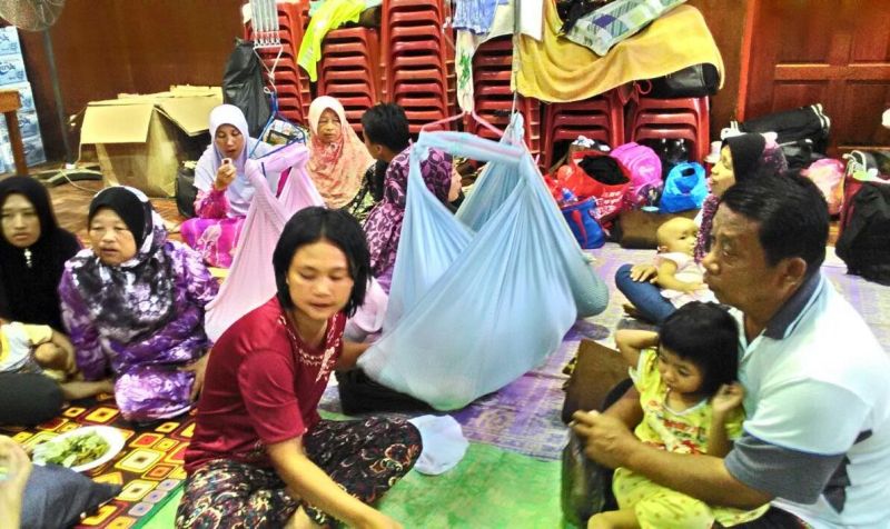 Noranah Nasir and her husband Jaludin Ibrahim, who is with her family of six children in the Ranau community hall, said her home along the Liwagu river is at risk from the overflowing. 