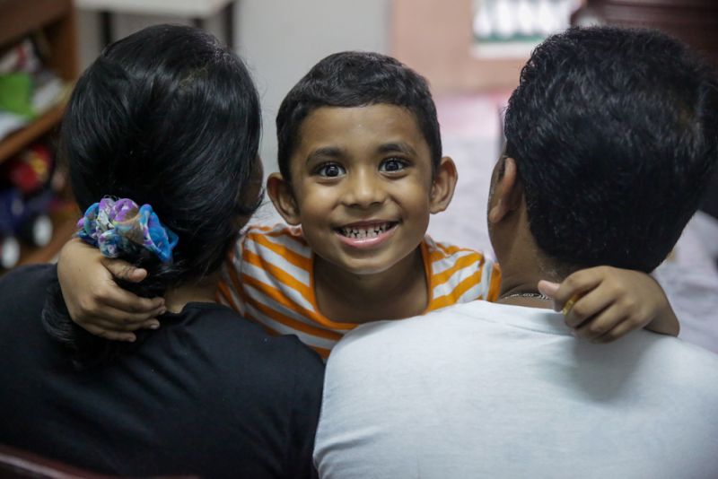 Kavi and his parents, who requested not to be photographed. ― Picture by Choo Choy May