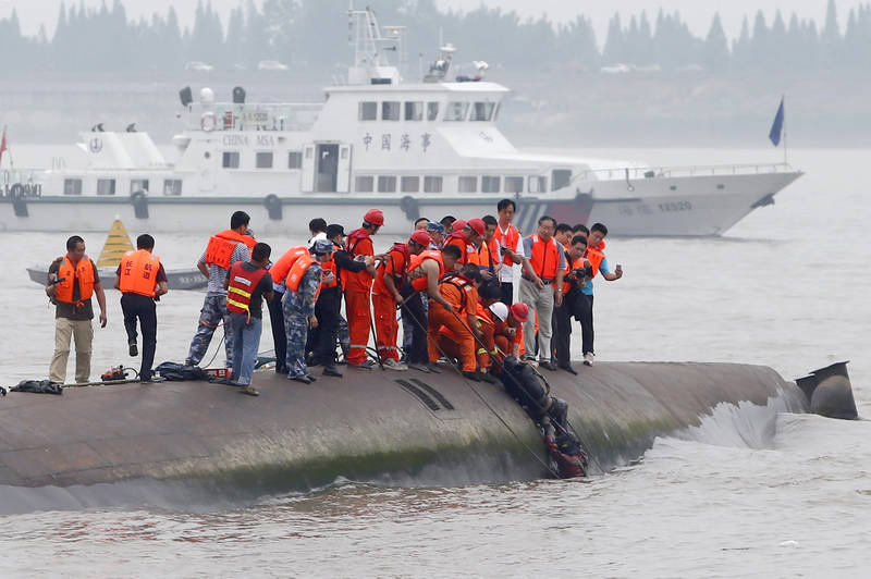 A man is pulled out alive by divers and rescuers after a ship sank at the Jianli section of the Yangtze River in China, June 2, 2015. — Reuters pic
