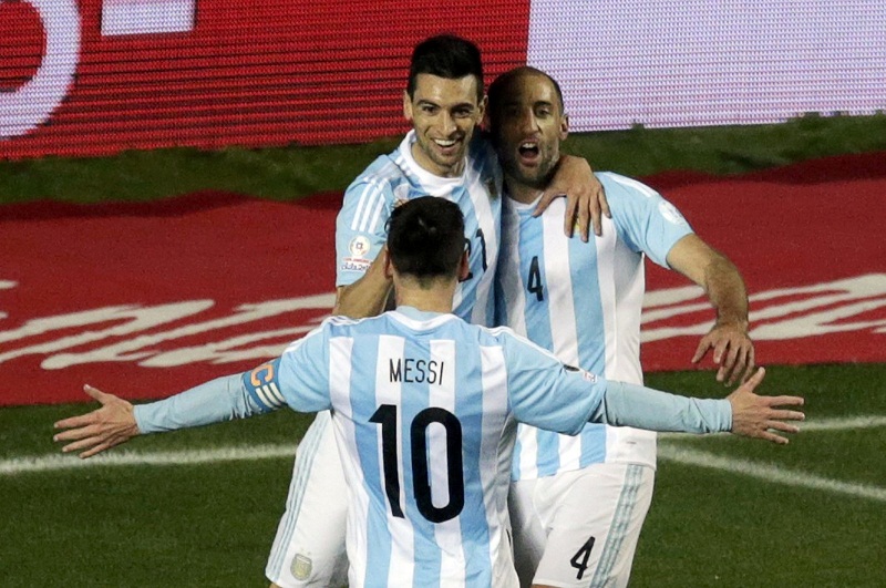 Argentinau00e2u20acu02dcs Javier Pastore celebrates his goal against Paraguay with Pablo Zabaleta (right) and Lionel Messi during their Copa America 2015 semi-final football match at Estadio Municipal Alcaldesa Ester Roa Rebolledo in Concepcion, Chile, June 30, 2015.