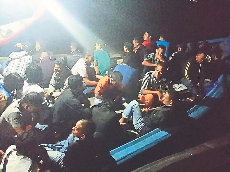 Some of the 59 caught in a fishing boat taking illegal immigrants home to Indonesia for Hari Raya. u00e2u20acu201d Picture by Port Klang Marine Police