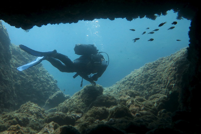 A scuba diver makes his way out from an underwater passageway at Isola Bella in Taormina, Italy, at the start of summer holiday season on the Mediterranean island of Sicily July 7, 2015. u00e2u20acu201d Reuters pic