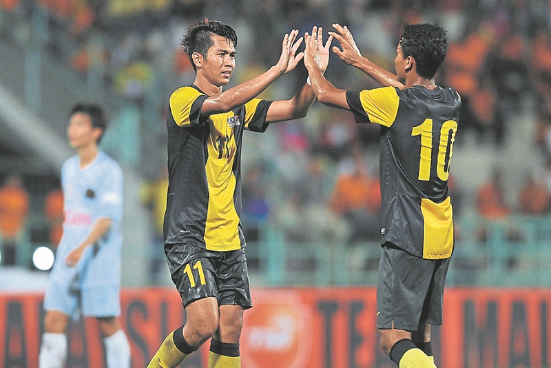 Rozaimi (left) celebrates after scoring a goal with Mohamad Ridzuan Abdullah during the international friendly match between Malaysia Under 23 vs FC Ryukyu at PJ City Council field. u00e2u20acu201d Picture courtesy of Malay Mail