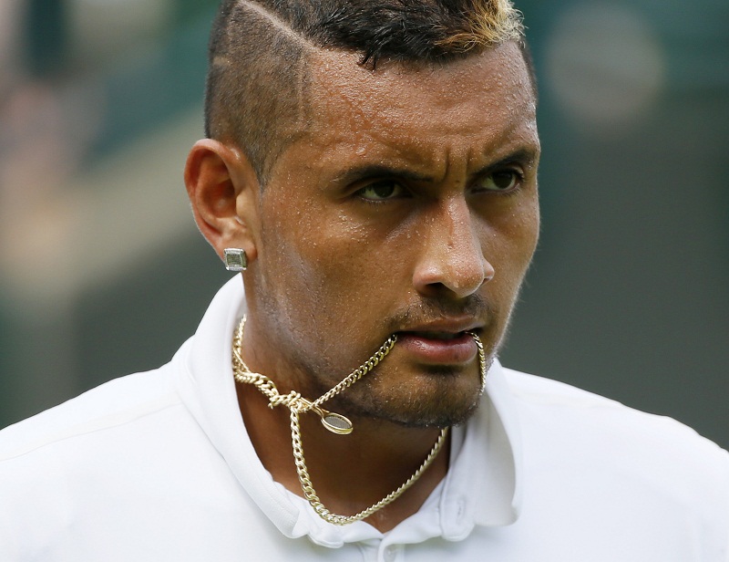 Nick Kyrgios of Australia holds his necklace in his mouth during his match against Juan Monaco of Argentina at the Wimbledon Tennis Championships in London, July 1, 2015.u00e2u20acu201d Reuters pic