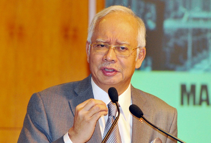 Prime Minister Datuk Seri Najib Tun Razak hands over the 2015 Inaugural Fellows to Cabinet ministers at the Perdana Putra building in Putrajaya, July 8, 2015. u00e2u20acu201d File pic