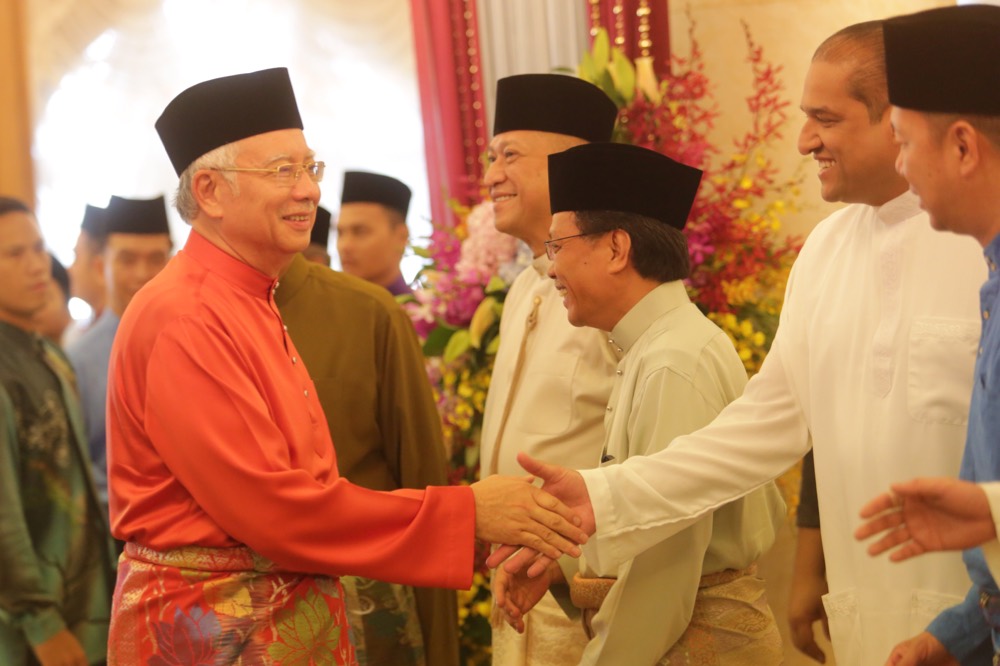 Prime Minister Datuk Seri Najib Razak (left) greets guest at a Raya Open house at Seri Perdana, Putrajaya, on July 17, 2015. u00e2u20acu201d Picture by Choo Choy May