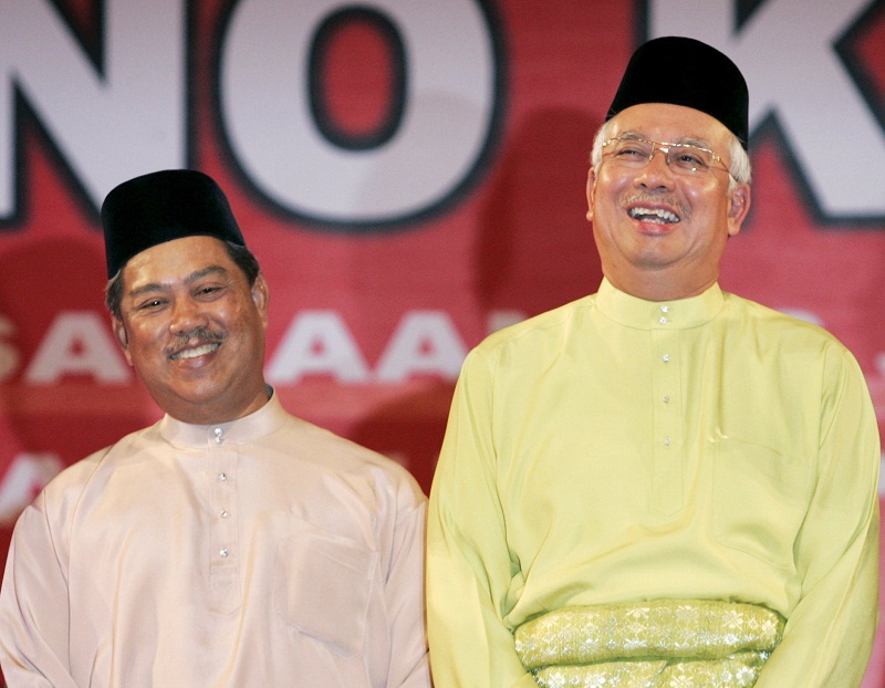 Prime Minister Datuk Seri Najib Razak (right) and his former deputy Tan Sri Muhyiddin Yassin share a light moment during the 63rd anniversary of Umno in Kuala Lumpur in this May 11, 2009 file photo. u00e2u20acu201d Reuters pic