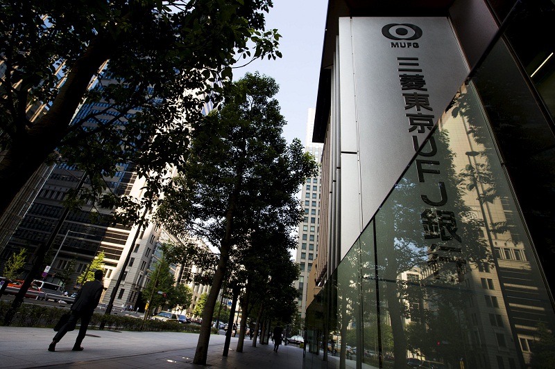 A man walks past an office of Japanese bank Mitsubishi UFJ Financial Group Inc (MUFG) in Tokyo July 31, 2015. u00e2u20acu201d Reuters pic