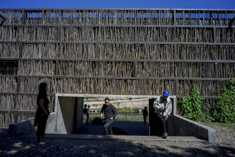 The library’s base is a steel and glass box in the vein of a Philip Johnson open-plan creation from the 1950s, but its exterior walls and roof are clad with fruit-tree twigs. — Picture by Sim Chi Yin/The New York Times