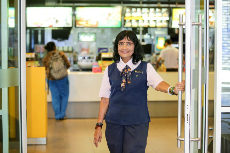 Cynthia opening the doors to welcome customers to Mutiara Damansara McDonald’s outlet.