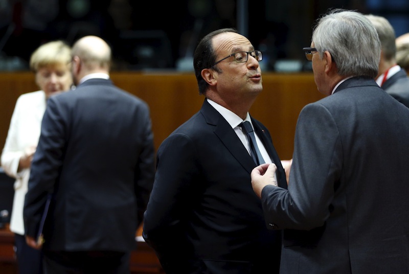 Hollande talks to European Commission President Jean-Claude Juncker (right) next to Merkel and European Parliament President Martin Schulz (left) during an euro zone leaders summit in Brussels, Belgium, July 12, 2015. u00e2u20acu201d Reuters pic