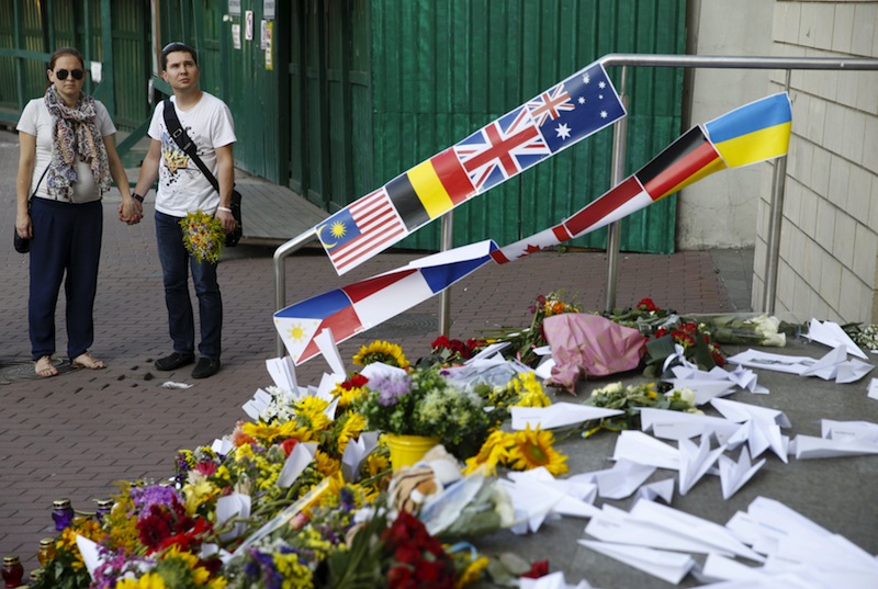 People gather outside the Dutch embassy to commemorate the victims of the Malaysia Airlines flight MH17 plane crash a year ago in Kiev, Ukraine, July 17, 2015.u00c2u00a0u00e2u20acu201d Reuters pic