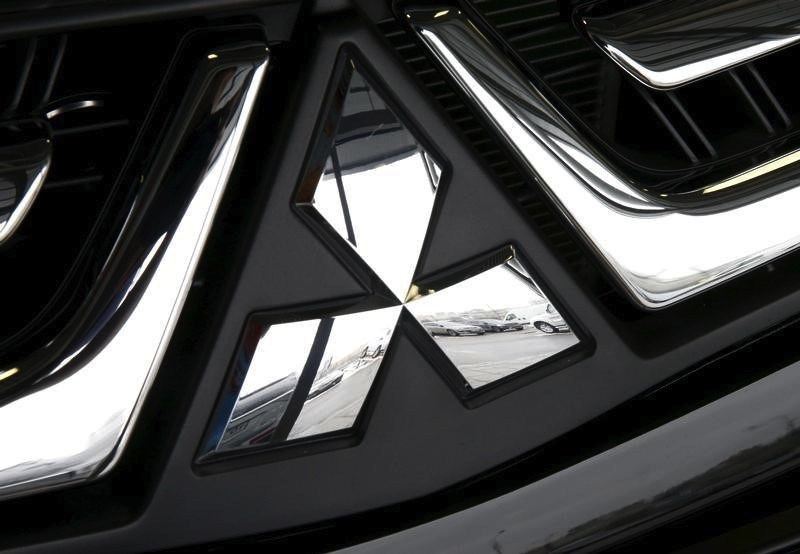 Vehicles are reflected in the logo of a Mitsubishi at a showroom of the Avtomir company, a Mitsubishi cars dealership, in Moscow, April 1, 2015. u00e2u20acu201d Reuters pic