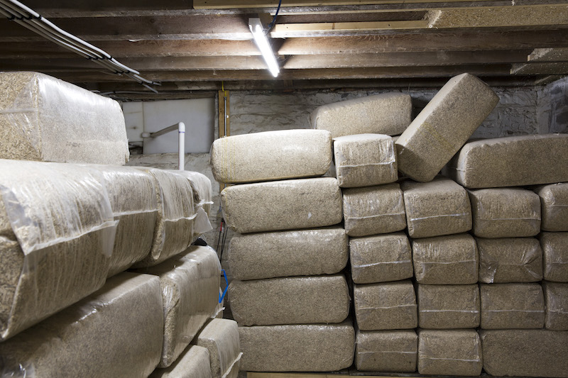 Bagged hemp chips in James Savage's basement that will be mixed with lime and turned into a paste that then dries in place, called hempcrete, in Stuyvesant, New York, July 3, 2015. — Picture by Preston Schlebusch/The New York Times