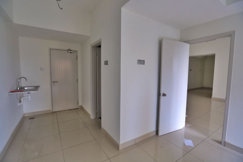 A dual-key condominium, with the mini-studio unit on the left and the main section on the right. ― Picture by Saw Siow Feng