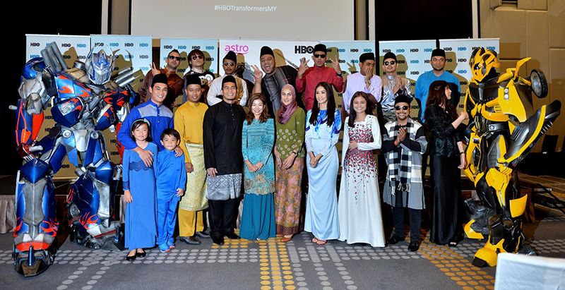 Optimus Prime (left), Bumblebee (right), the stellar voiceover talents and representatives from HBO Asia and Astro at a buka puasa launch recently. u00e2u20acu201d File pic