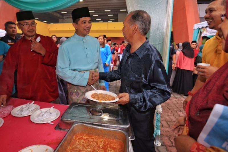 Selangor Mentri Besar Azmin Ali (centre) greeting visitors to the Selangor government Raya open house at Stadium Shah Alam, July 19, 2015. u00e2u20acu201d  Picture by Saw Siow Feng