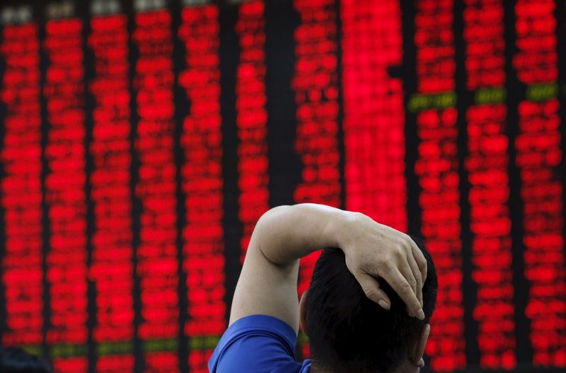 A man watches a board showing stock prices at a brokerage office in Beijing, July 1, 2015. u00e2u20acu201d Reuters pic