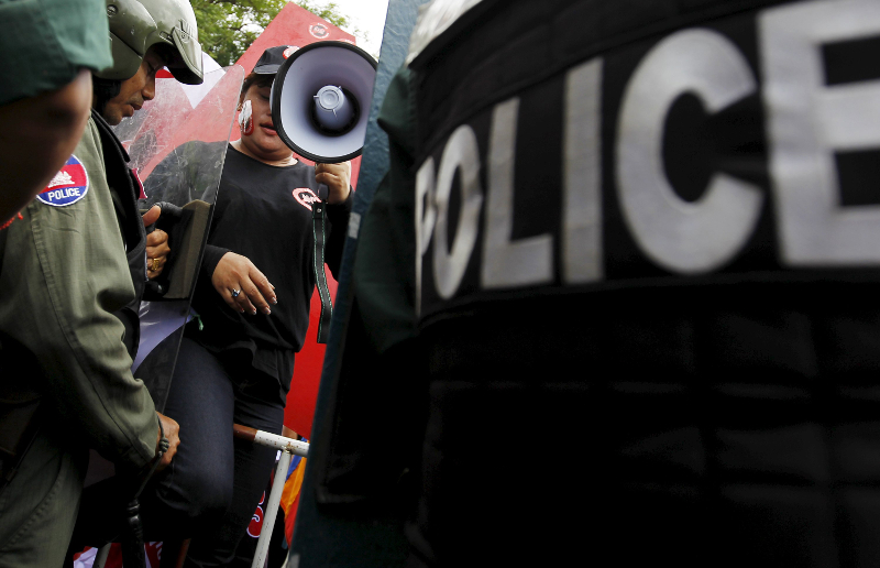 A woman is blocked by police officers as she marches to the Cambodia National Assembly during a protest in Phnom Penh July 13, 2015. u00e2u20acu201d Reuters pic