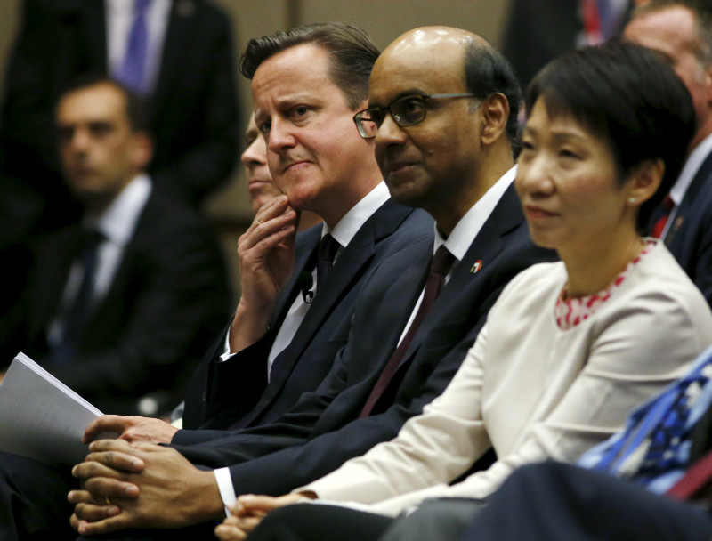 British Prime Minister David Cameron (left) waits to deliver a lecture next to Singaporean ministers Tharman Shanmugaratnam (centre) at the Lee Kuan Yew School of Public Policy in Singapore, July 28, 2015. u00e2u20acu201d Reuters pic