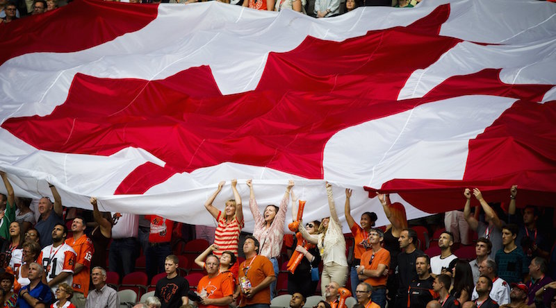 A Canadian flag is passed along fans during the B.C Lions home opener against the Saskatchewan Roughriders over during their CFL football game in Vancouver, British Columbia, July 10, 2015. u00e2u20acu201d Reuters pic