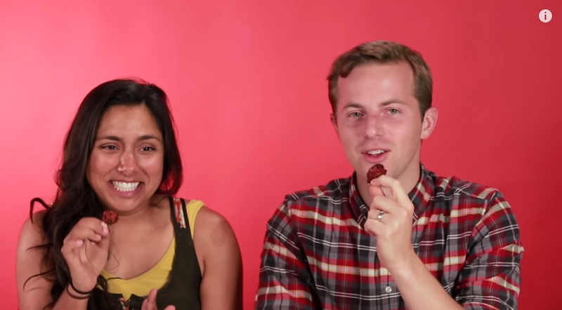 Two volunteers try the Carolina Reaper, also known as the world's hottest chilli pepper, in this screenshot taken from the BuzzFeed video.