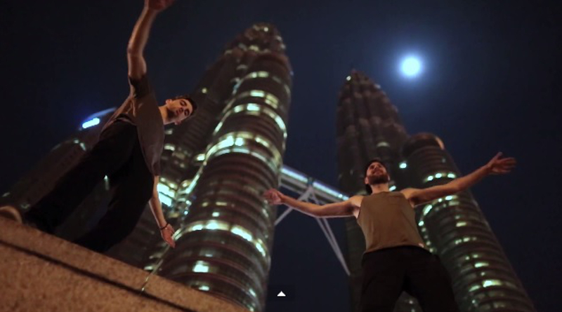 DJ duo Chainsmokers stand under the Petronas Twin Towers in this screenshot taken from their YouTube music video for 'Roses'.