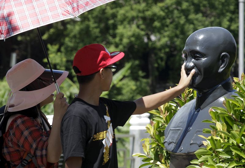 A person touches a statue of the late president and Nationalist leader Chiang Kai-shek in Taoyuan, nothern Taiwan, July 10, 2015. u00e2u20acu201d Reuters pic