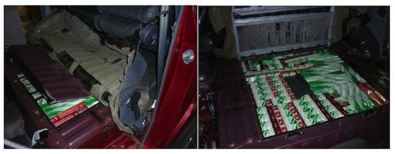 Contraband cigarettes hidden in modified floorboard of the car. u00e2u20acu201d TODAY pic