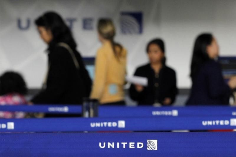 Customers of United Airlines wait in line to check in at Newark International airport in New Jersey, November 15, 2012. u00e2u20acu201d Reuters pic