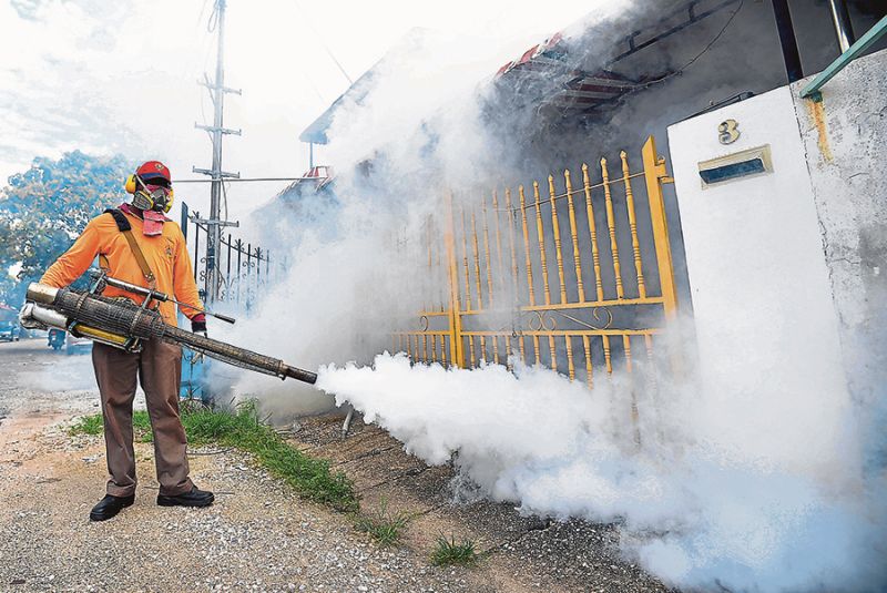 A city council worker carries out fogging in Taman Pakatan, Ipoh, as the number of dengue cases in Perak and other states show significant increases. u00e2u20acu201d Picture by Marcus Pheong