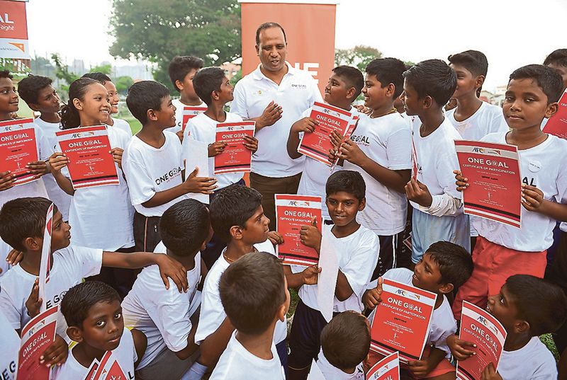 National football coach Dollah Salleh mingles with the u00e2u20acu02dcOne Goalu00e2u20acu2122 clinic participants in Jinjang yesterday. u00e2u20acu201d Bernama pic