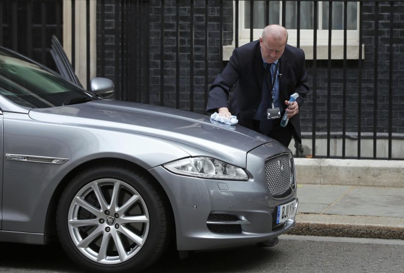 A security officer polishes the official car of Britain's Prime Minister David Cameron which is parked in front of Number 10 Downing Street in London, Britain July 8, 2015. u00e2u20acu201d Reuters pic